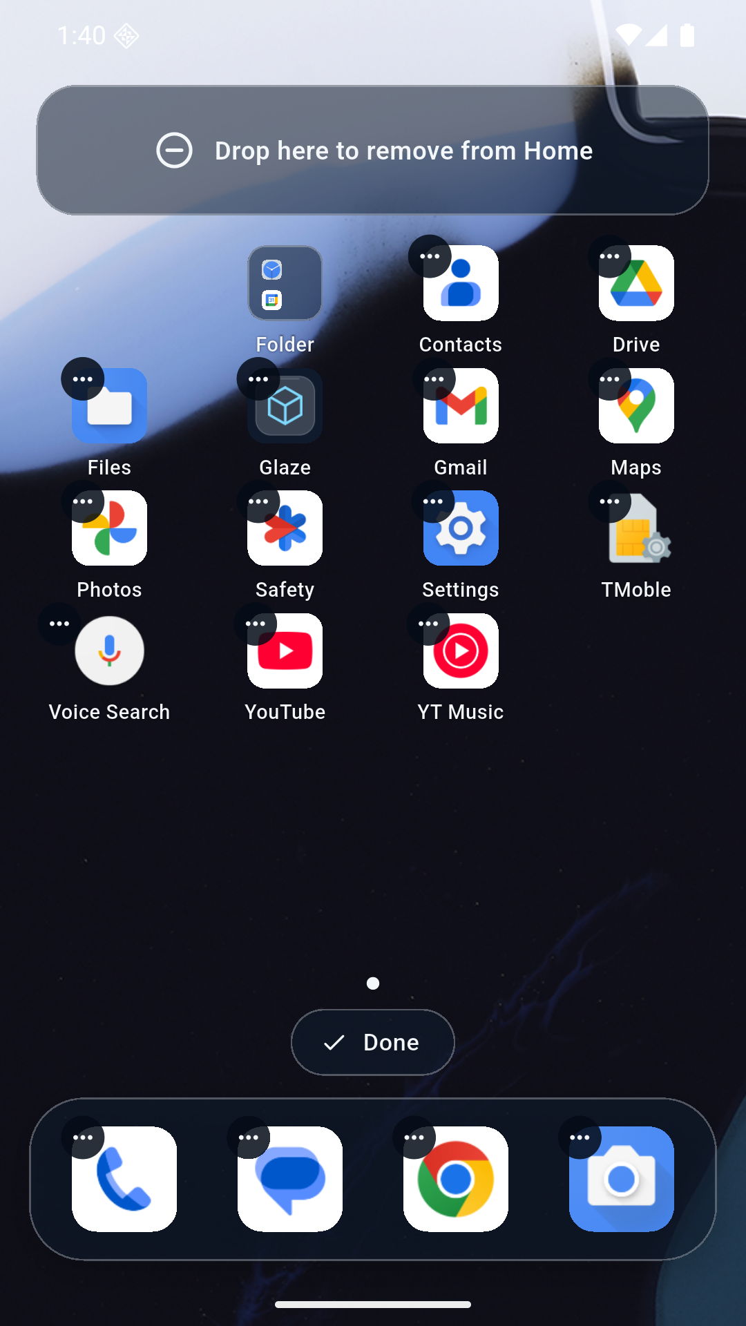 Edit mode with an icon being dragged and a drop zone to remove it from Home